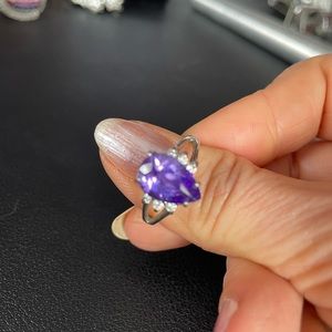 Beautiful Amethyst ring with 3 small diamonds on either side.